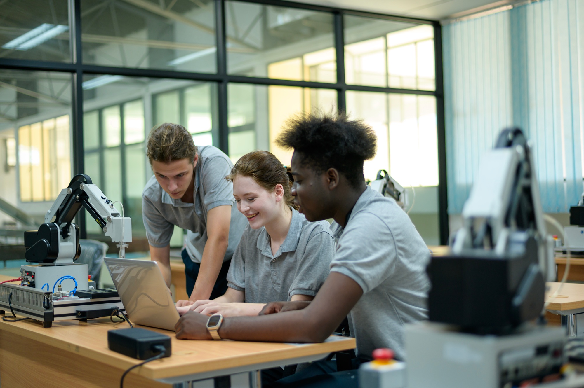 Trainee Robotics engineer learning with Programming Robot Hand